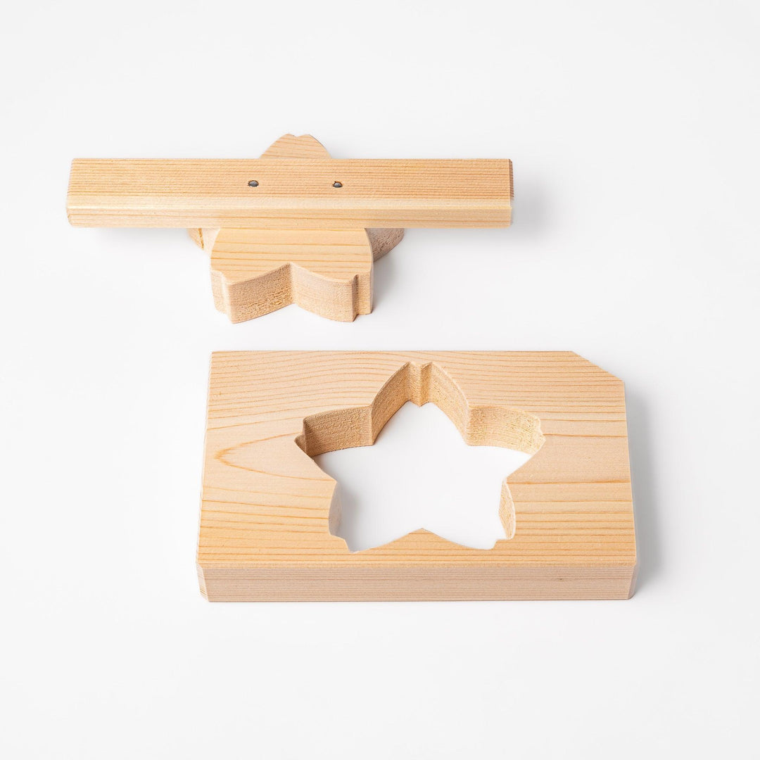 Hinoki onigiri mold in sakura shape, designed to press rice into floral forms with natural aroma.