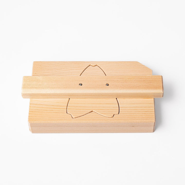 Hinoki onigiri mold in sakura shape, designed to press rice into floral forms with natural aroma.