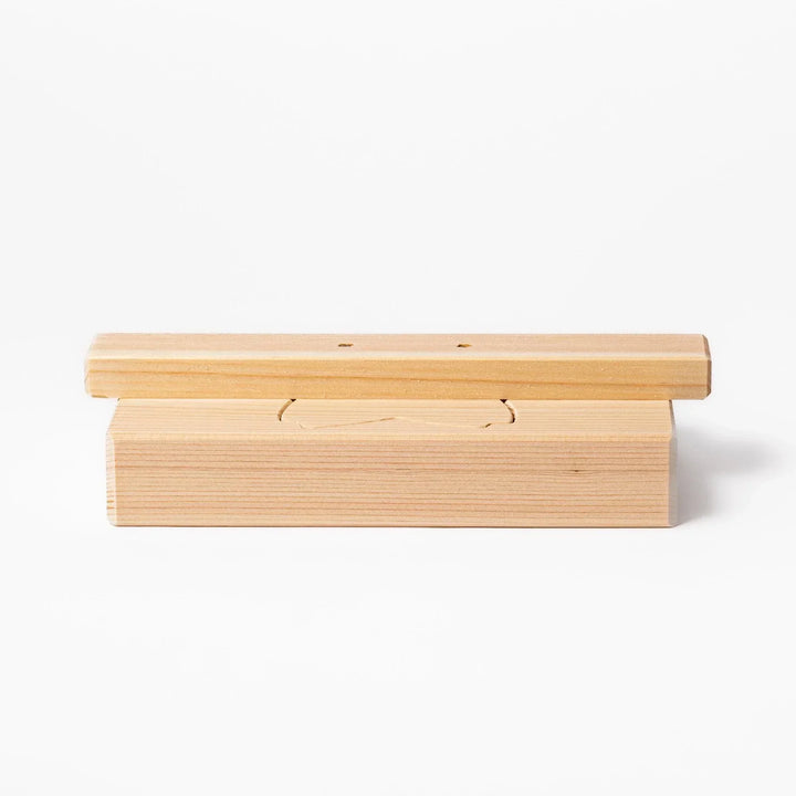 Hinoki onigiri mold in sakura shape, designed to press rice into floral forms with natural aroma.