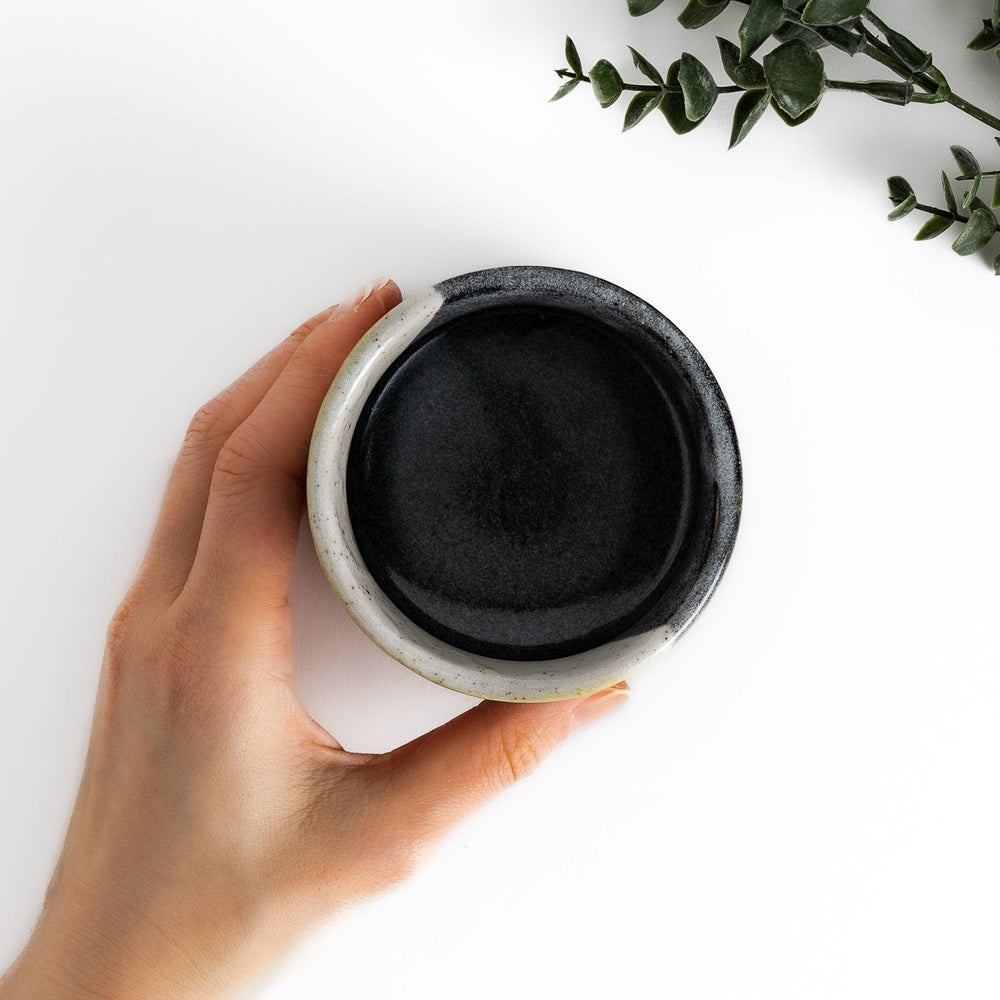 Tea Cups featuring Hokusai's Great Wave design, with vibrant blue waves and a golden gradient background.