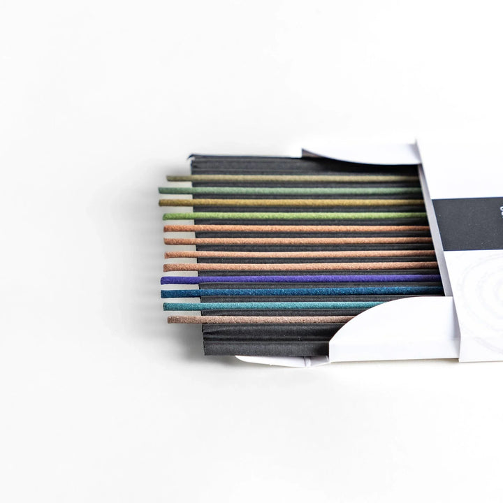 Japanese Hyakurakukou amber incense set by Kousaido Kyoto featuring assorted colored sticks in elegant white box.