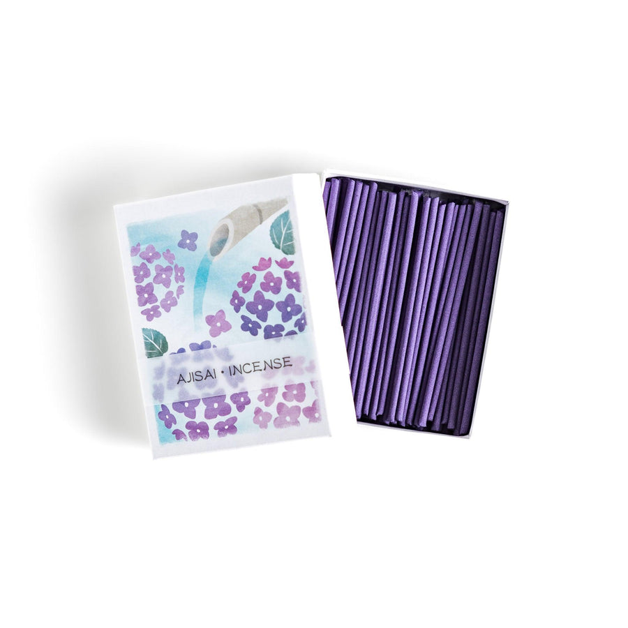Incense with purple sticks in a hydrangea box, offering a refreshing floral scent for a serene atmosphere.