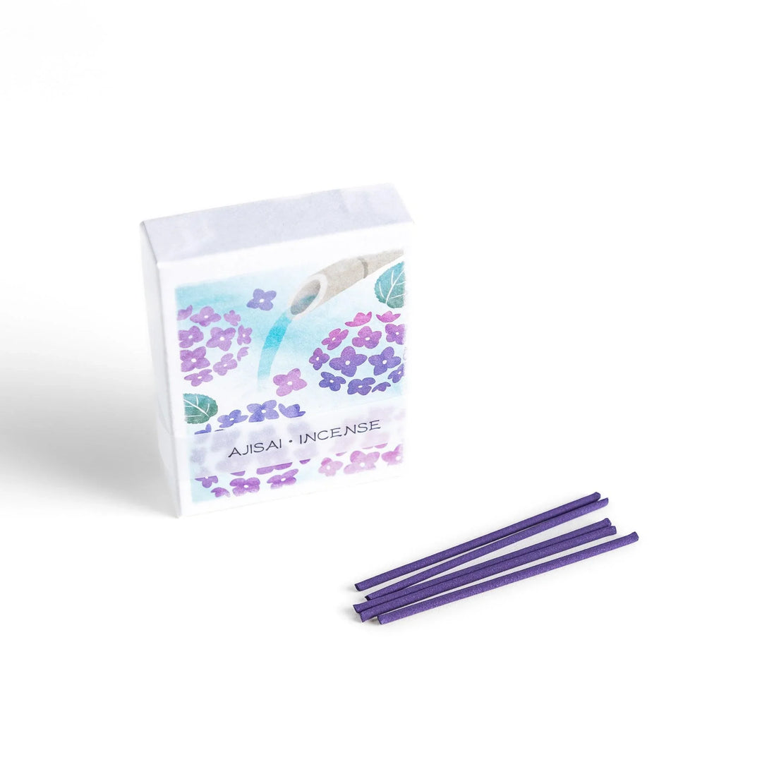 Incense with purple sticks in a hydrangea box, offering a refreshing floral scent for a serene atmosphere.