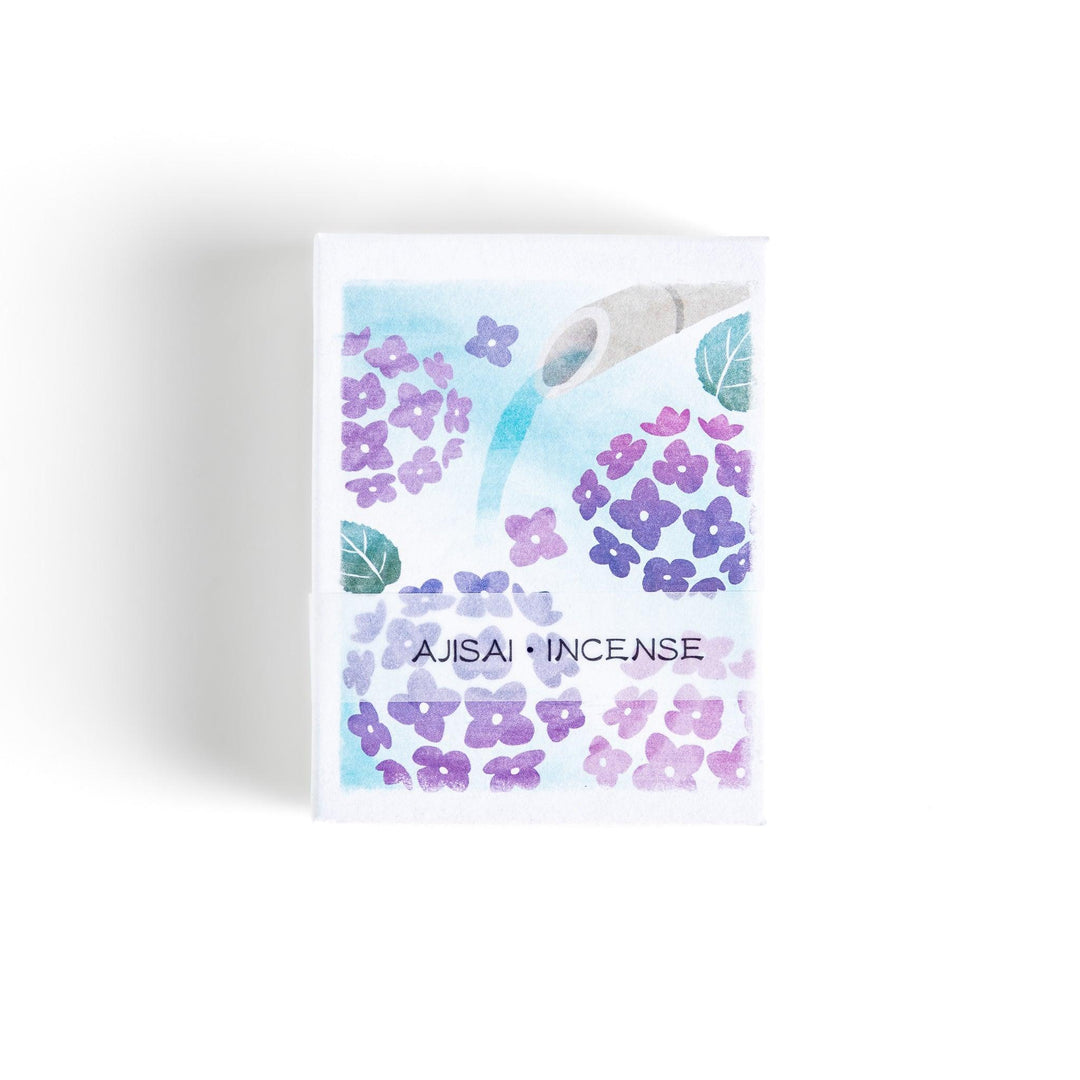 Incense with purple sticks in a hydrangea box, offering a refreshing floral scent for a serene atmosphere.