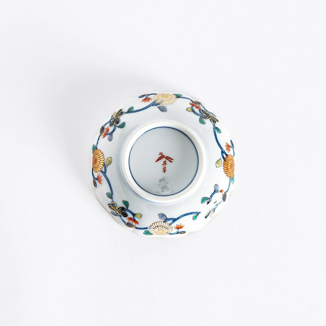 Bottom view of the Imperial Blossom sauce dish, showing the smooth white porcelain and any maker's mark beneath the dish.