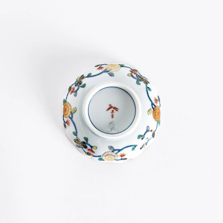 Bottom view of the Imperial Blossom sauce dish, showing the smooth white porcelain and any maker's mark beneath the dish.