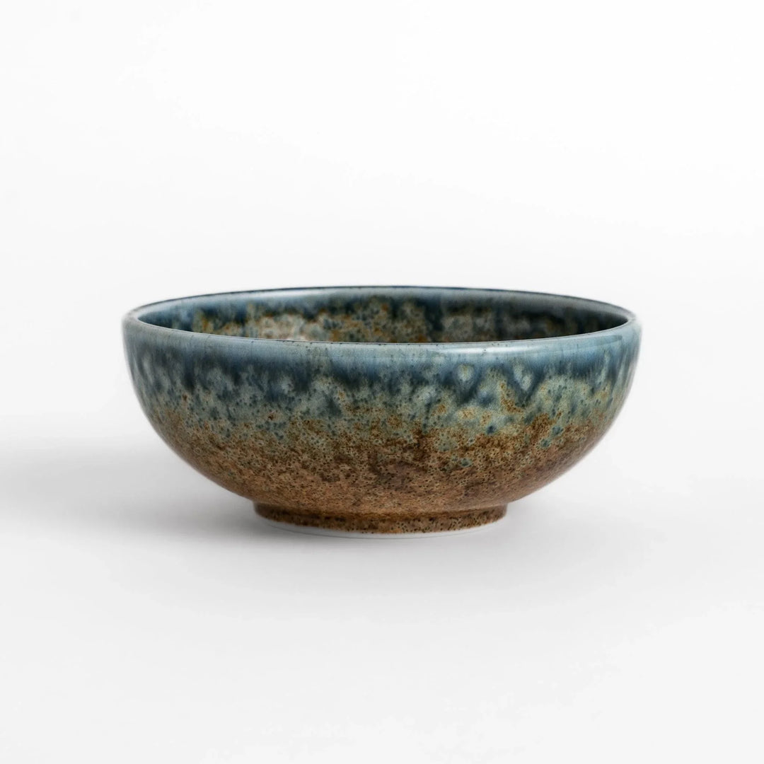 Dessert bowl featuring a beautiful indigo glaze with a stunning ombré effect, transitioning from deep blue to earthy brown