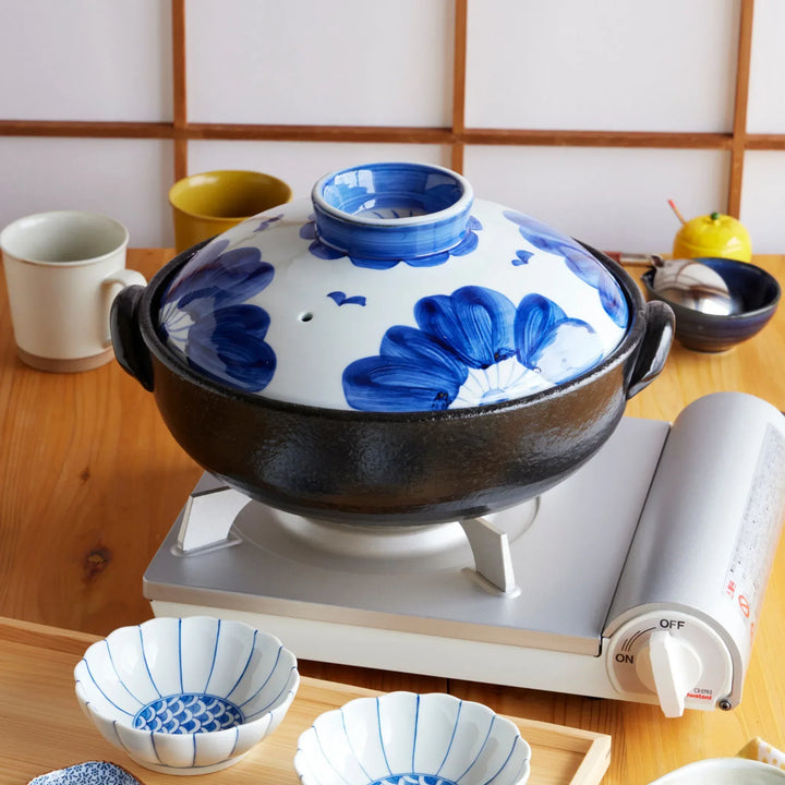 Indigo Floral Family-Size Donabe clay pot with hand-painted blue blossoms on lid, perfect for shared Japanese hot pot meals.