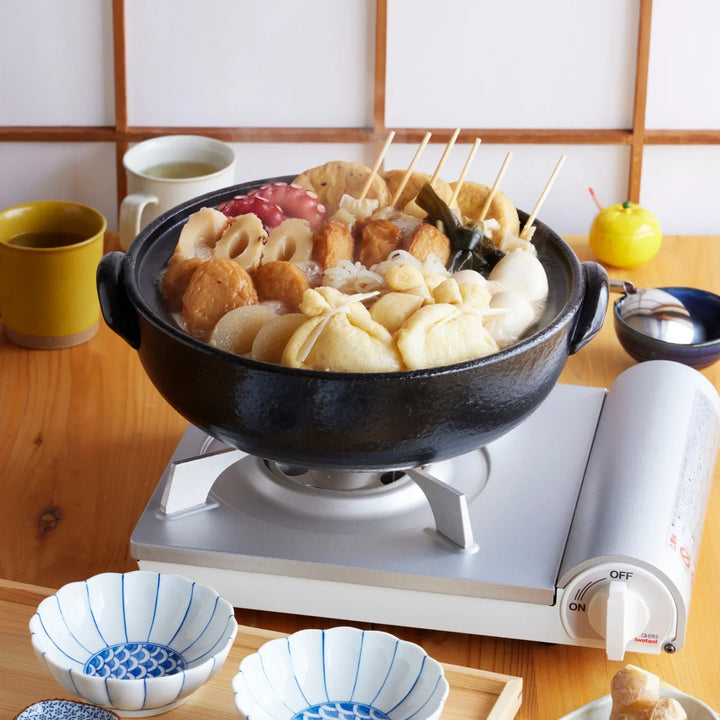 Indigo Floral Japanese family size donabe clay pot simmering oden with fish cakes tofu and vegetables.