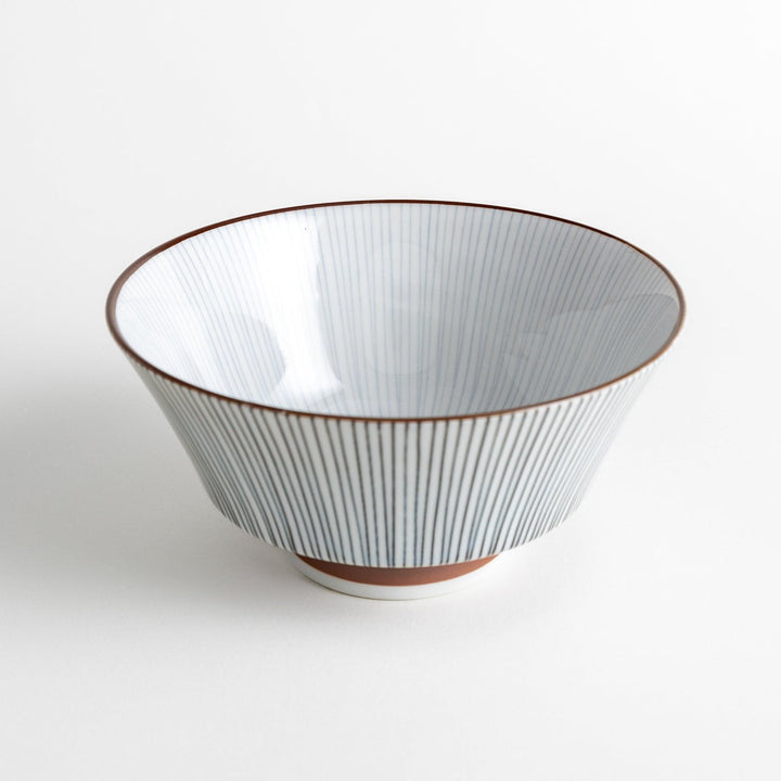 A white bowl with fine, vertical brown stripes and a brown rim, offering a sleek and modern design.