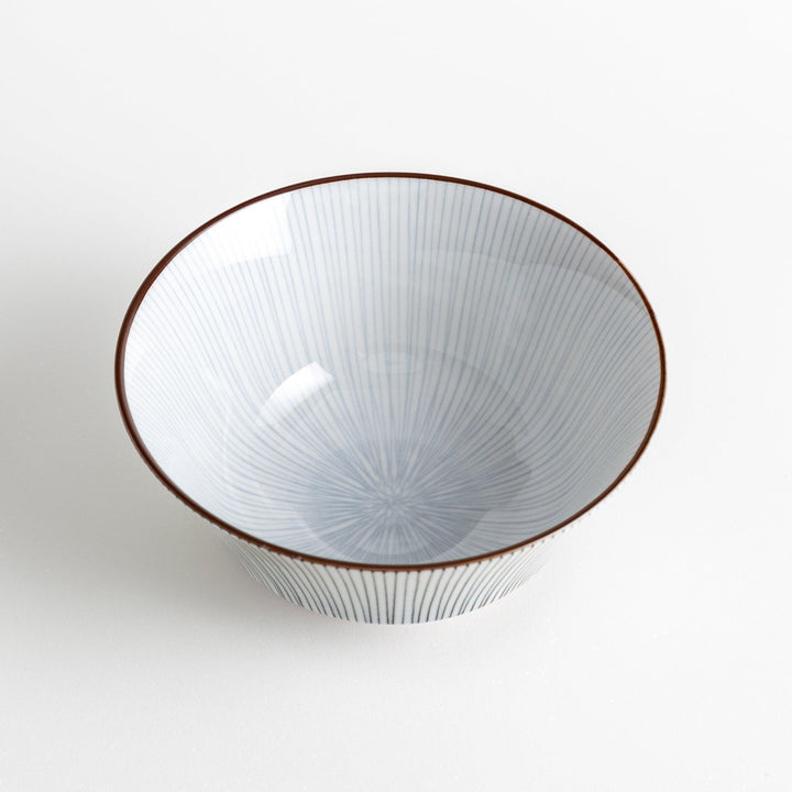 A white bowl with fine, vertical brown stripes and a brown rim, offering a sleek and modern design.