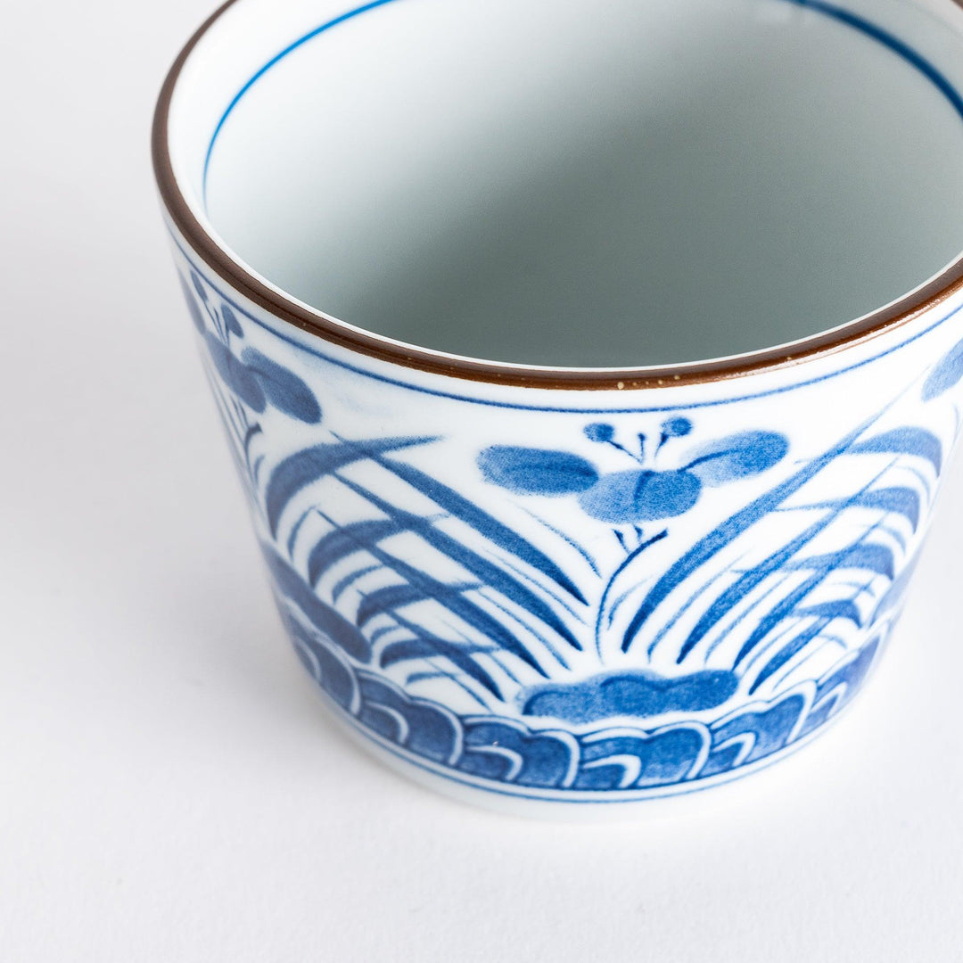 Iris Arabesque Condiment Bowl featuring elegant blue floral arabesque design inspired by Japanese motifs.