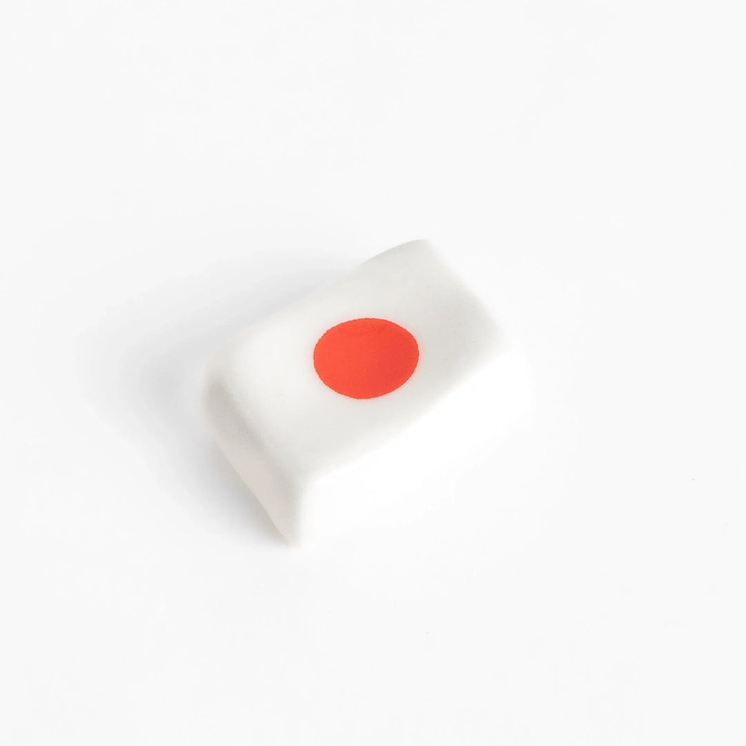 Chopstick rest shaped like the Japanese flag, with a red circle in the center, offering a minimalist and patriotic design.