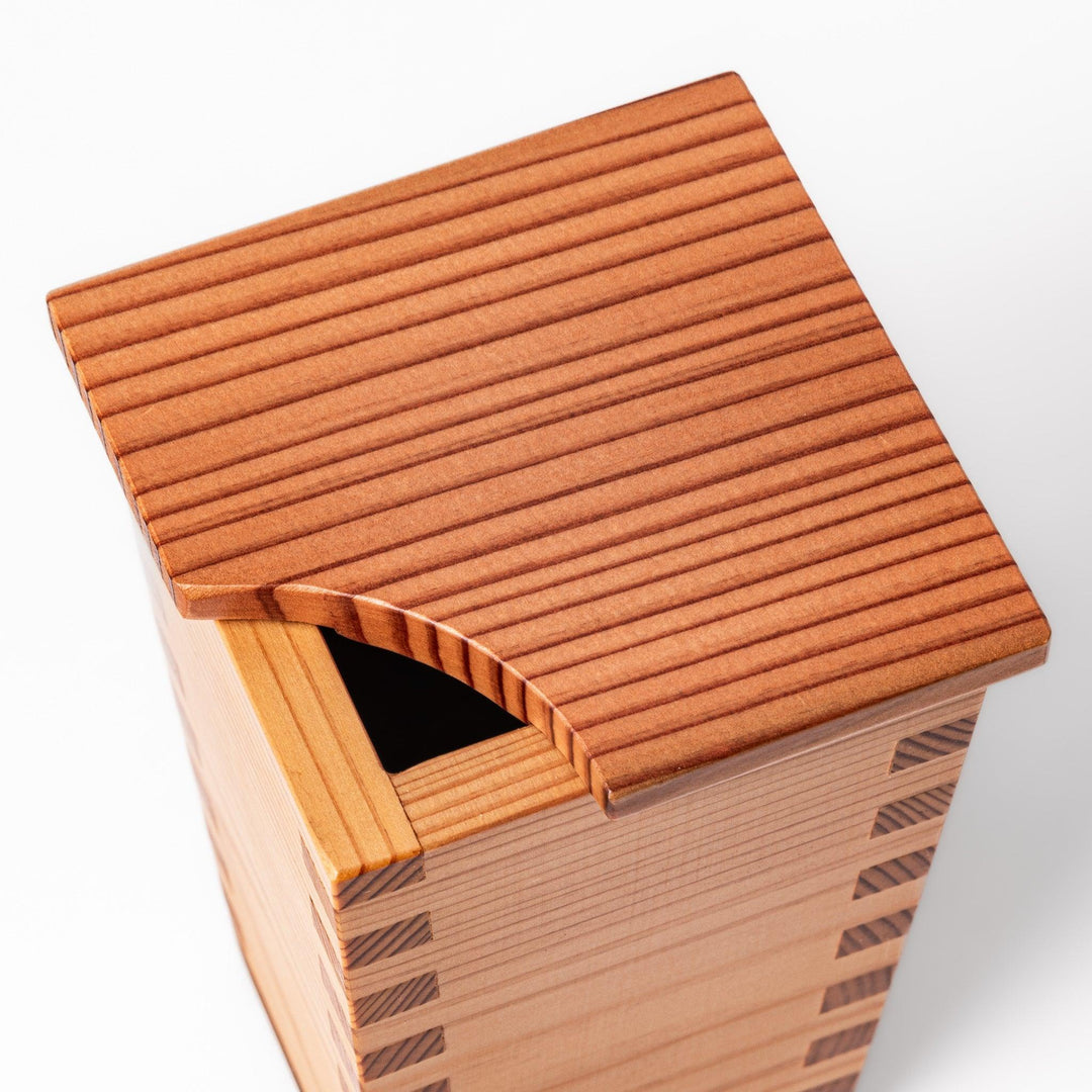 Cedar sake cup with smooth rim and visible grain, offering a warm, aromatic touch to traditional drinkware.