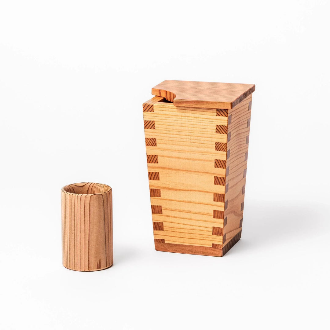 Cedar sake cup with smooth rim and visible grain, offering a warm, aromatic touch to traditional drinkware.