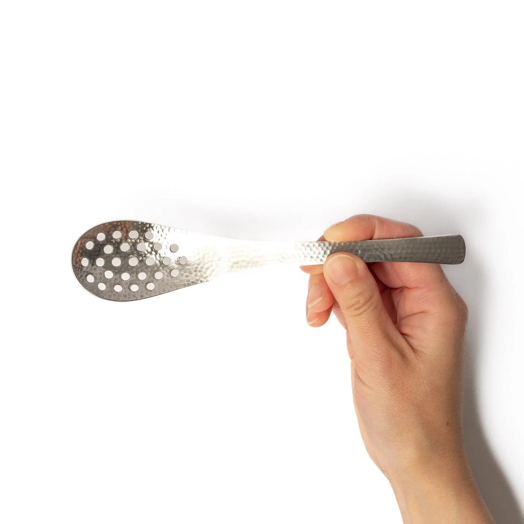 Japanese Hammered Straining Spoon with perforated bowl handcrafted for skimming or serving food easily.