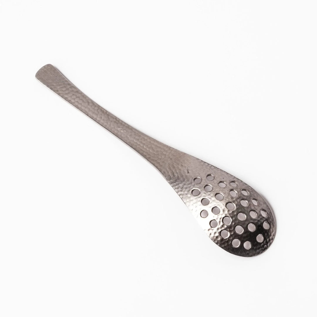 Japanese Hammered Straining Spoon with perforated bowl handcrafted for skimming or serving food easily.