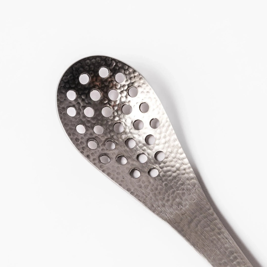 Japanese Hammered Straining Spoon with perforated bowl handcrafted for skimming or serving food easily.