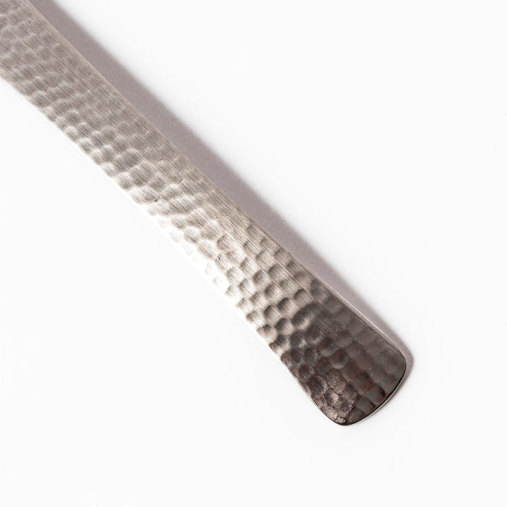 Japanese Hammered Straining Spoon with perforated bowl handcrafted for skimming or serving food easily.