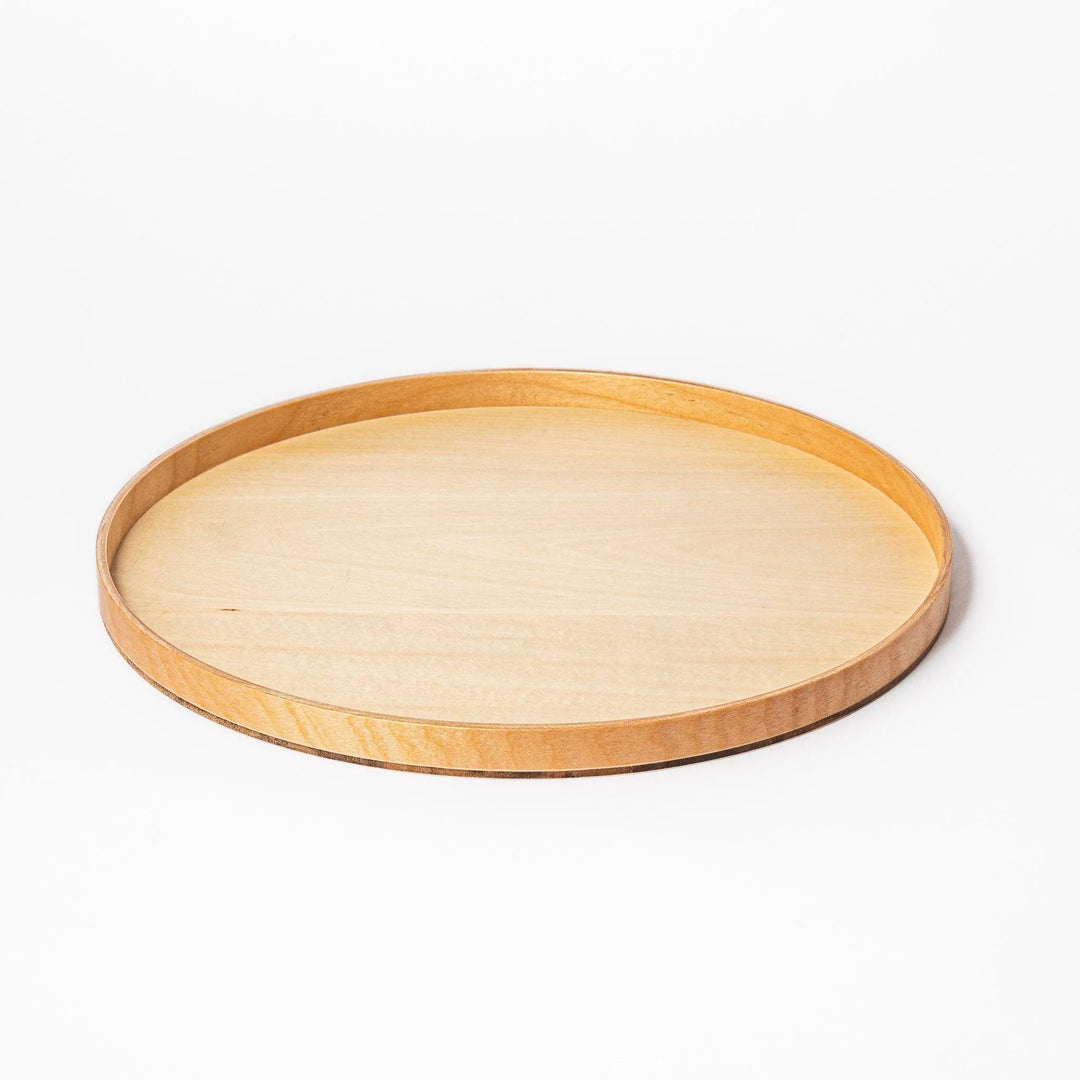 Minimalist Japanese round wooden tray with raised edge for serving tea snacks or organizing small items.