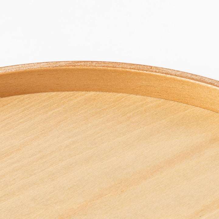 Minimalist Japanese round wooden tray with raised edge for serving tea snacks or organizing small items.