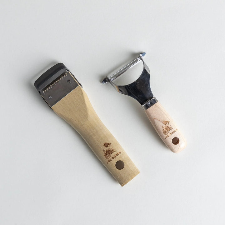 Japanese peeler set with wood handles and stainless blades for easy vegetable peeling and julienne slicing.