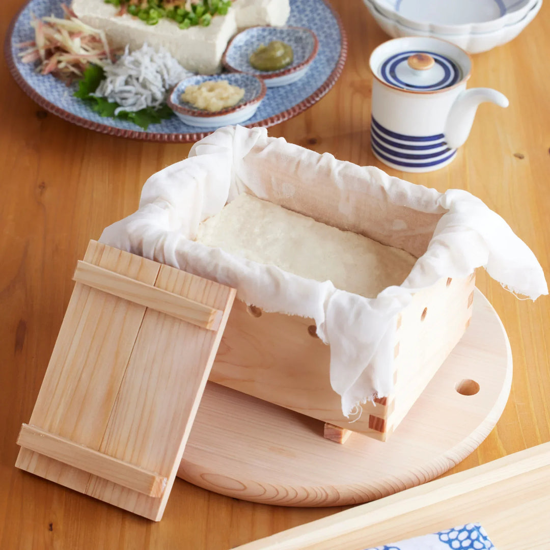 Handcrafted Hinoki tofu press box with cloth lining, designed for shaping smooth, aromatic homemade tofu.