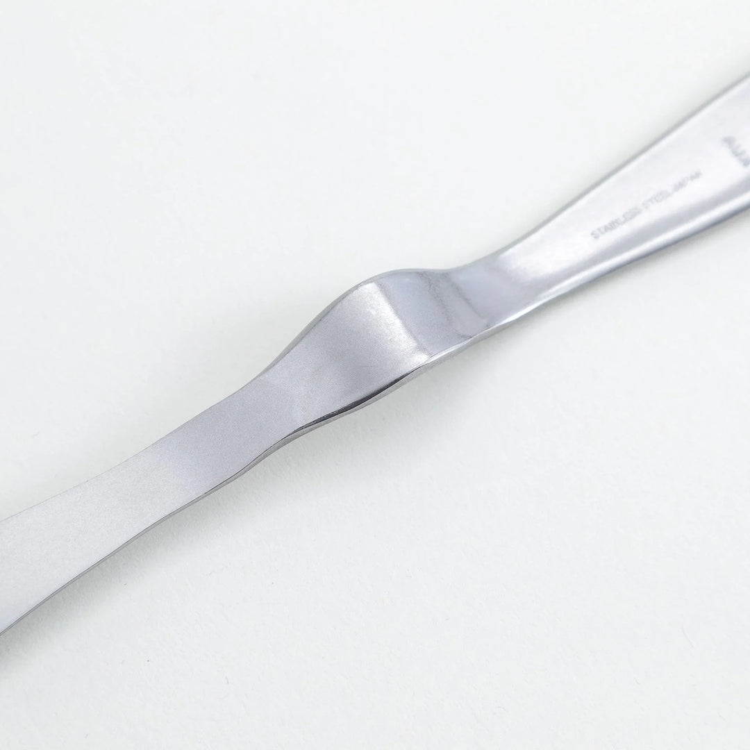 Stainless steel jam spreader with a sleek, double-ended design.
