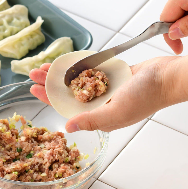 Stainless steel jam spreader with a sleek, double-ended design.