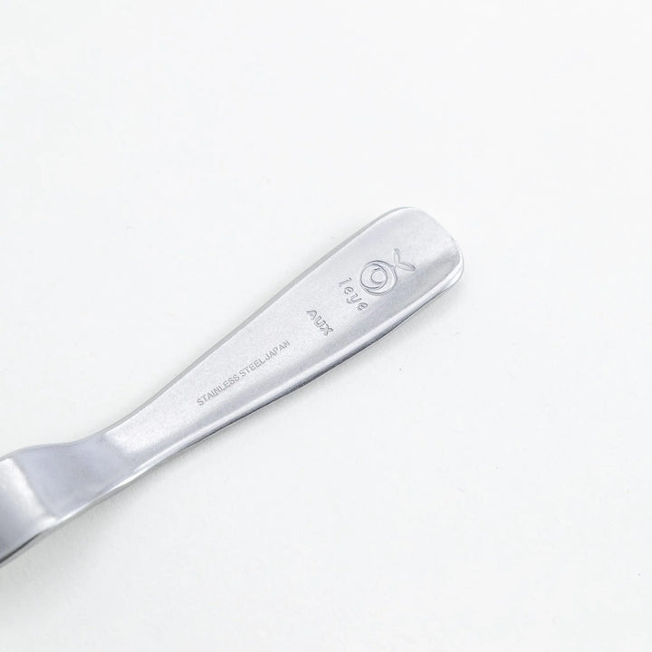 Stainless steel jam spreader with a sleek, double-ended design.