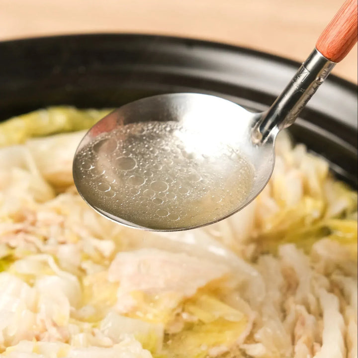 AUX stainless ladle for serving hot soups and stews directly from the pot, offering precision and balance.