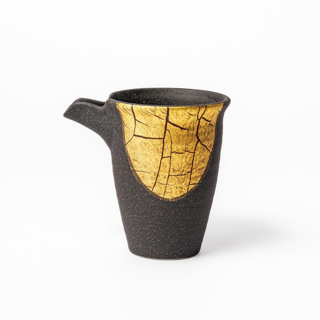 Black and gold Kutani sake set with spouted carafe and cups, blending Kintsugi art with modern elegance.