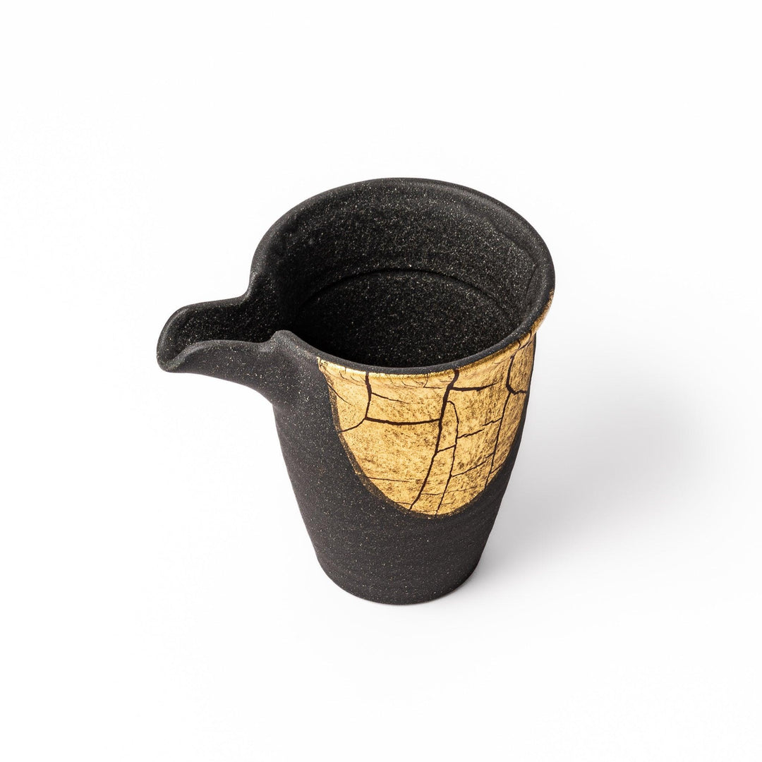 Black and gold Kutani sake set with spouted carafe and cups, blending Kintsugi art with modern elegance.