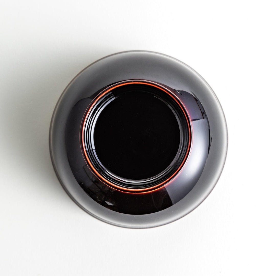 A smooth, glossy lacquer bowl with a minimalist design, perfect for soups or side dishes. Available in red and black.