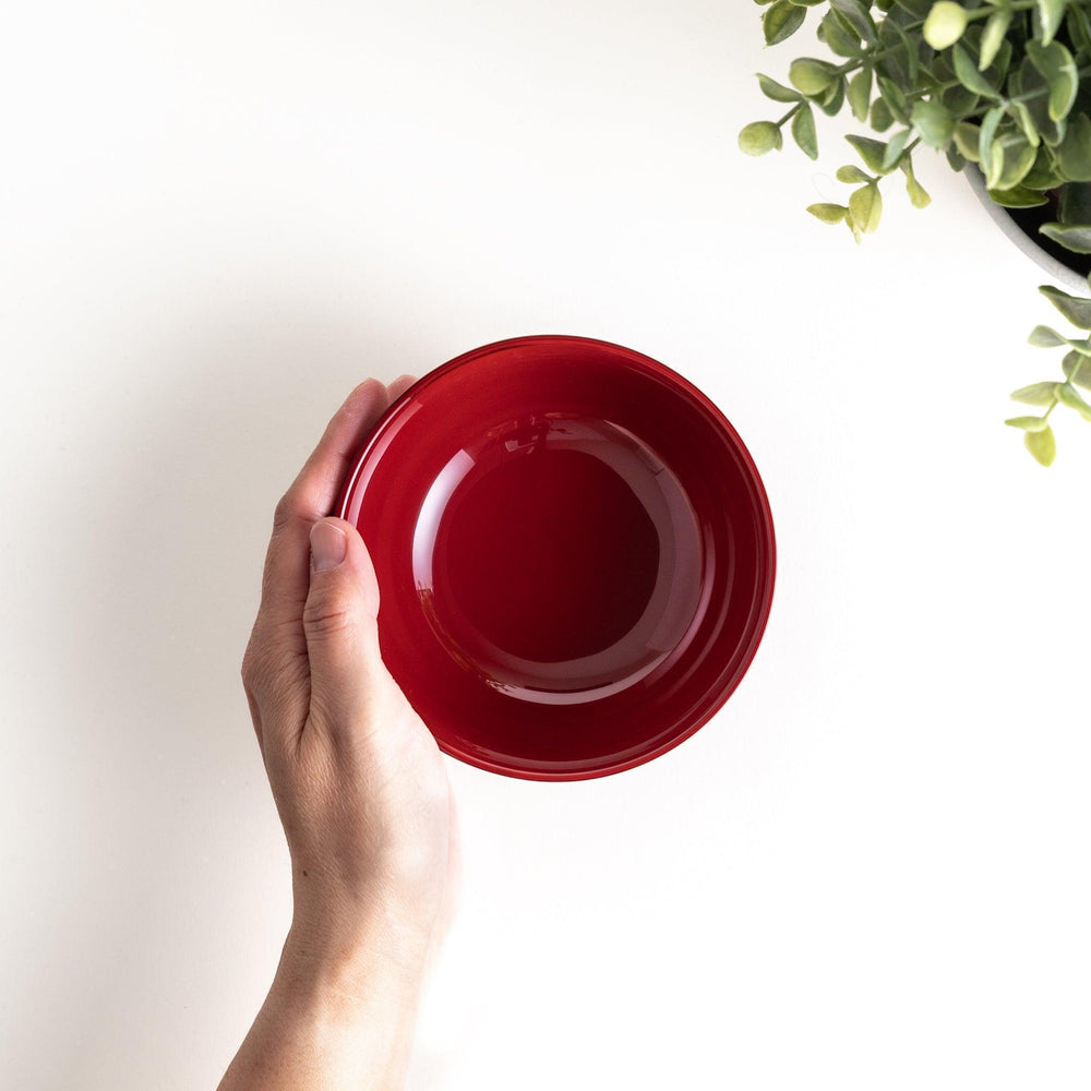 A smooth, glossy lacquer bowl with a minimalist design, perfect for soups or side dishes. Available in red and black.