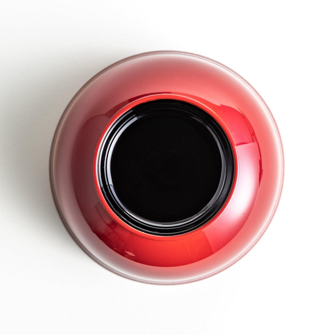 A smooth, glossy lacquer bowl with a minimalist design, perfect for soups or side dishes. Available in red and black.