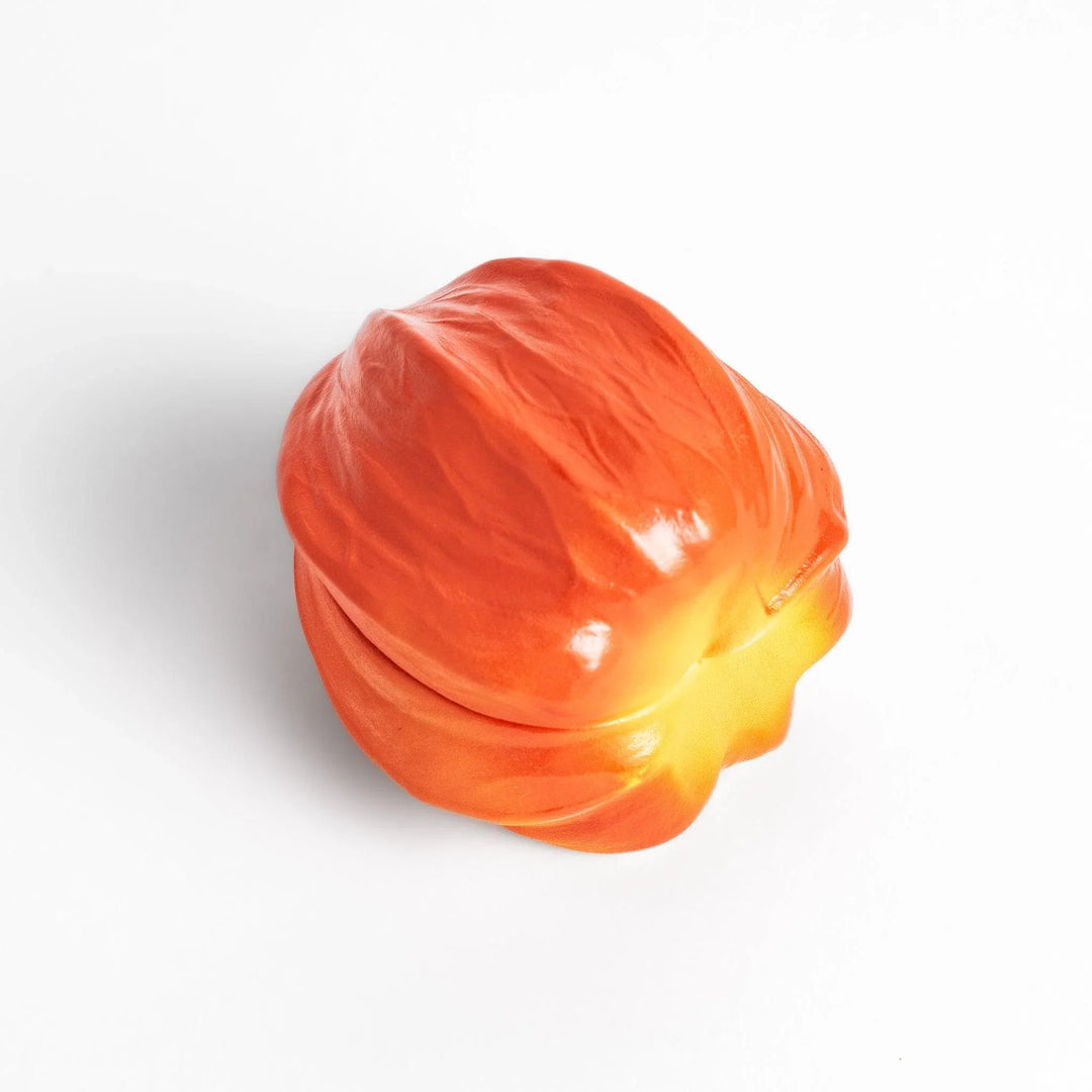 Handcrafted ceramic lidded bowl shaped like an orange lantern plant, ideal for serving condiments or small treats.