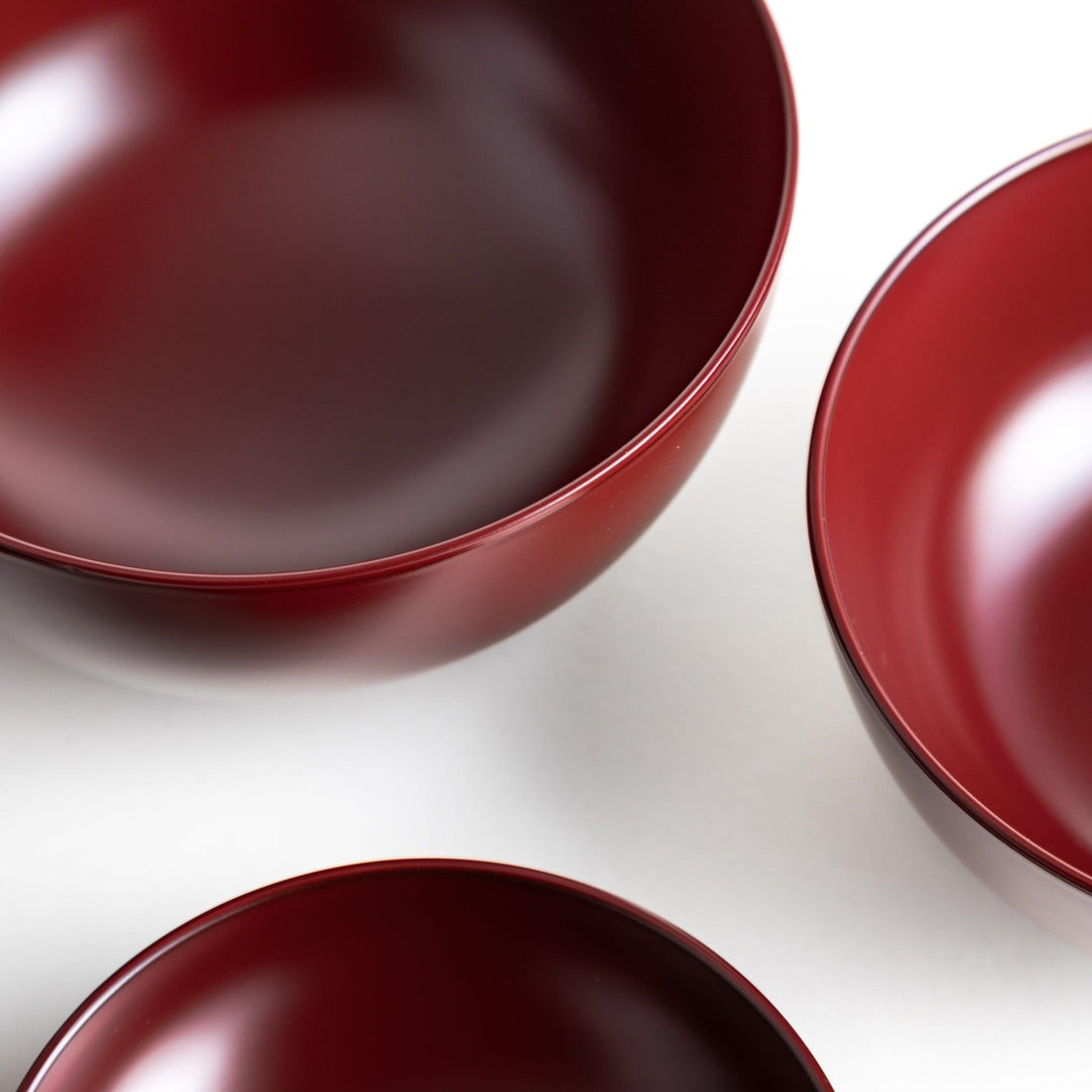 Set of five nested lacquer bowls with footed bases used in Japanese oryoki meals for formal mindful dining.