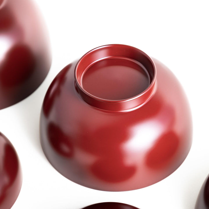 Set of five nested lacquer bowls with footed bases used in Japanese oryoki meals for formal mindful dining.