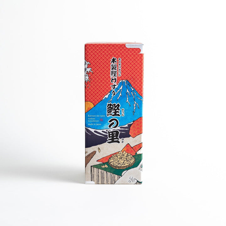 Large wooden katsuobushi shaver box with sliding drawer and lid and colorful Japanese artwork packaging.