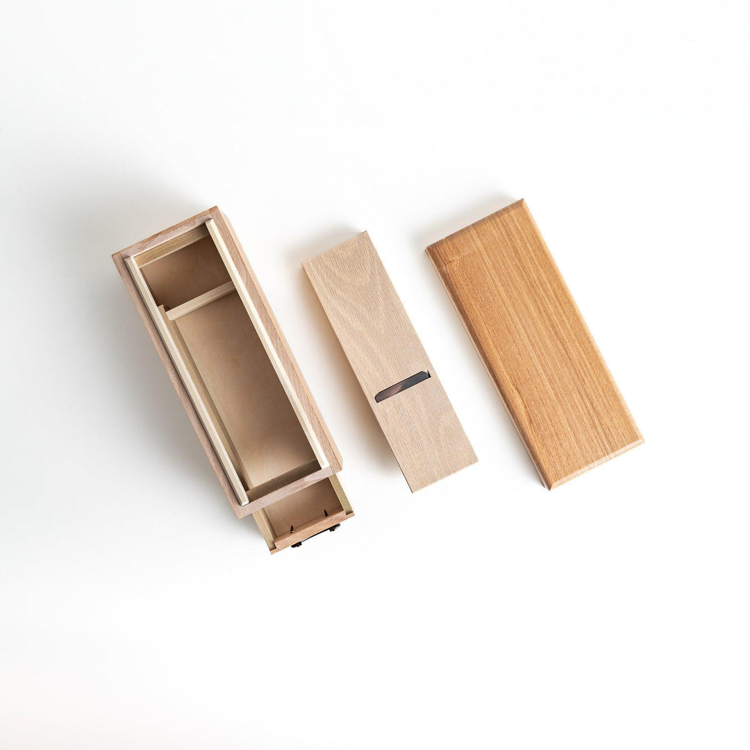 Large wooden katsuobushi shaver box with sliding drawer and lid and colorful Japanese artwork packaging.