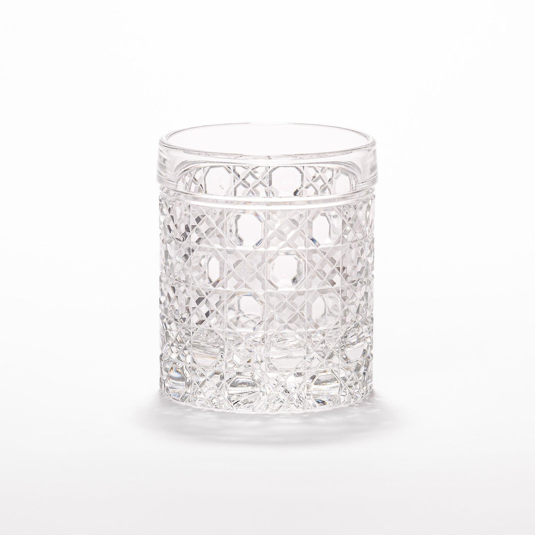 Rocks glass with lattice cut design, perfect for serving whiskey or spirits with a sophisticated touch.
