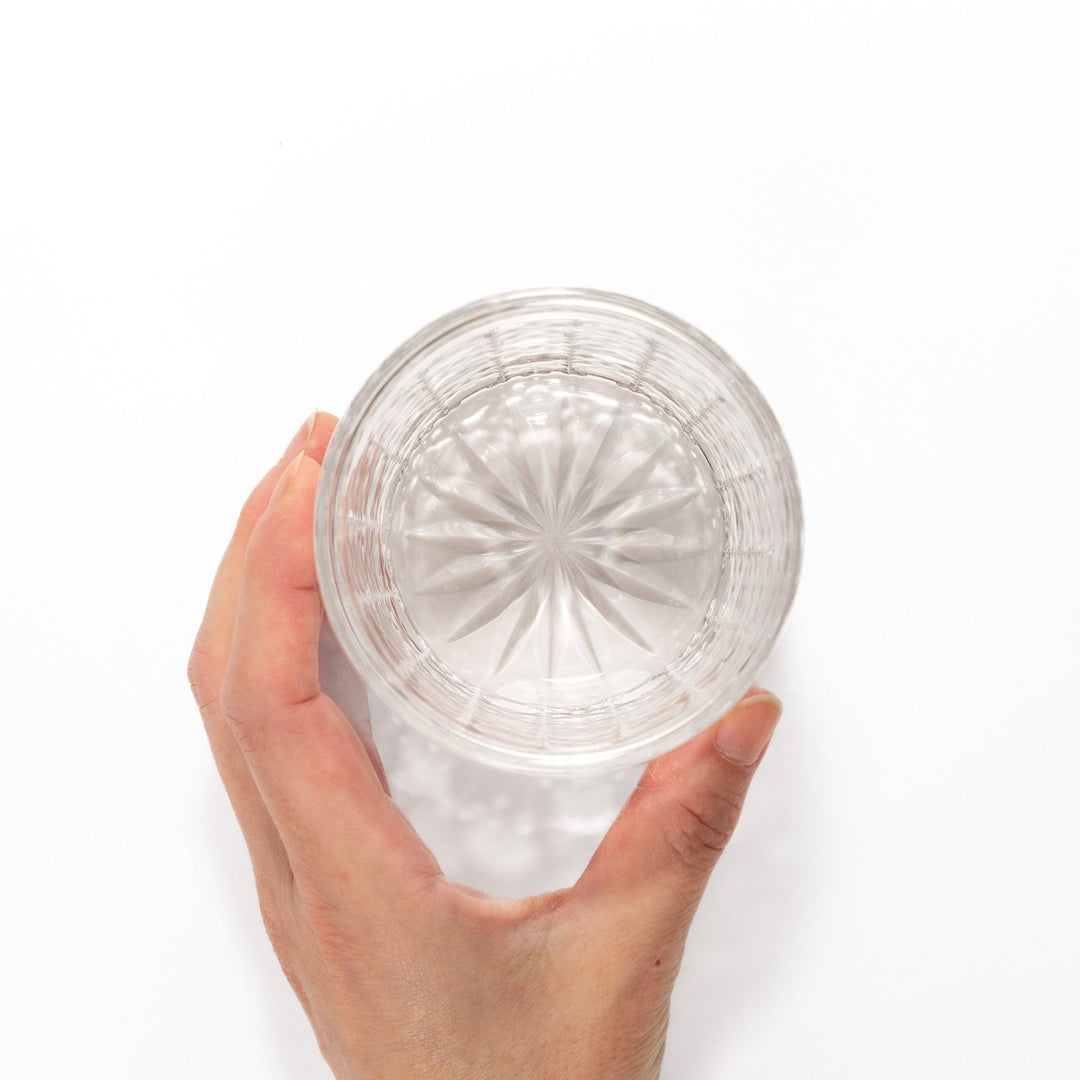 Rocks glass with lattice cut design, perfect for serving whiskey or spirits with a sophisticated touch.