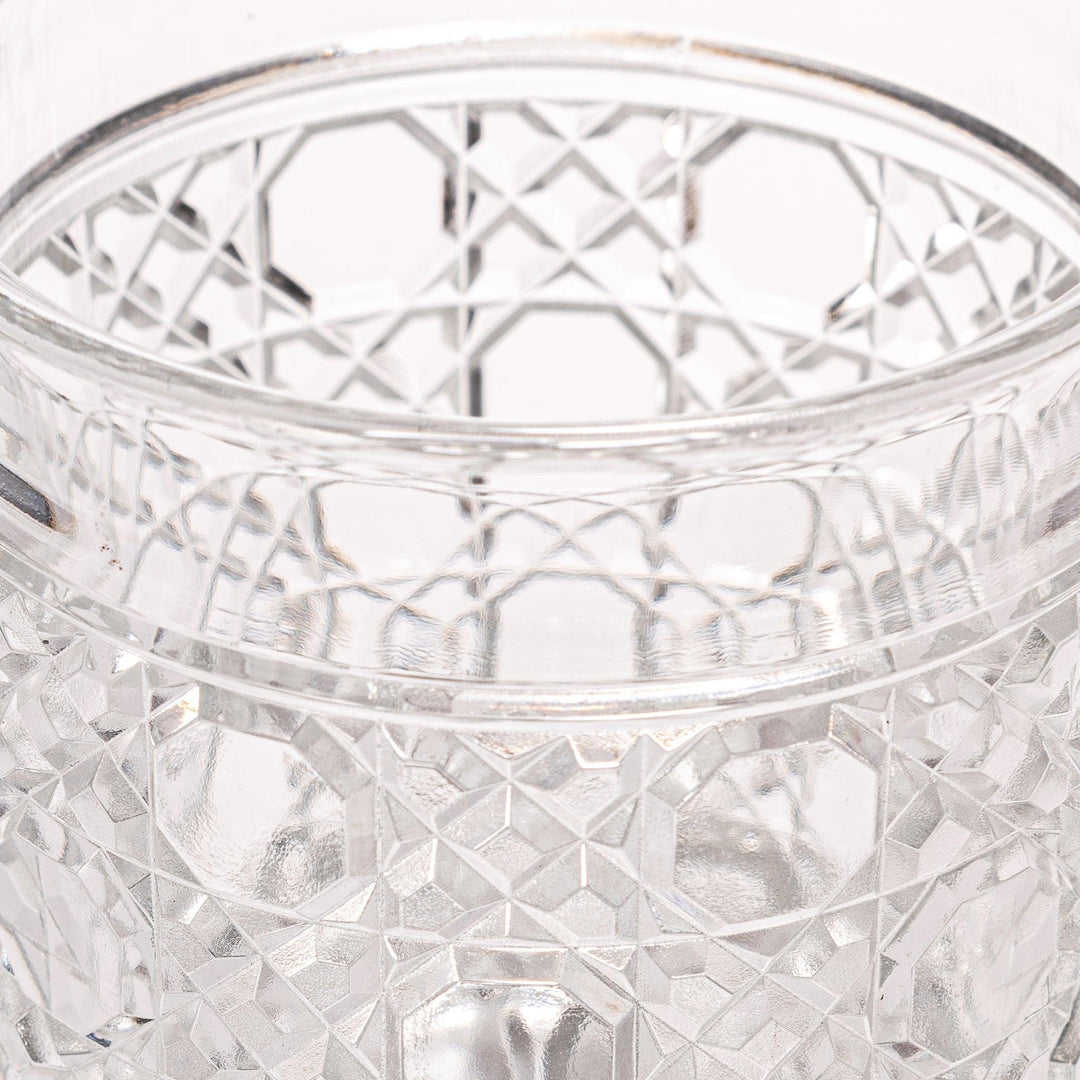 Rocks glass with lattice cut design, perfect for serving whiskey or spirits with a sophisticated touch.