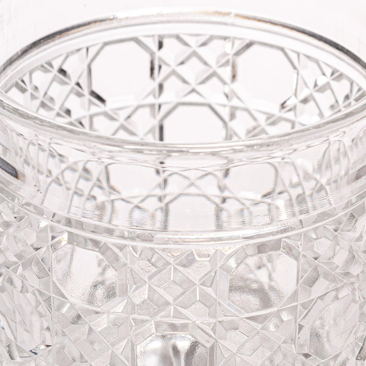 Rocks glass with lattice cut design, perfect for serving whiskey or spirits with a sophisticated touch.