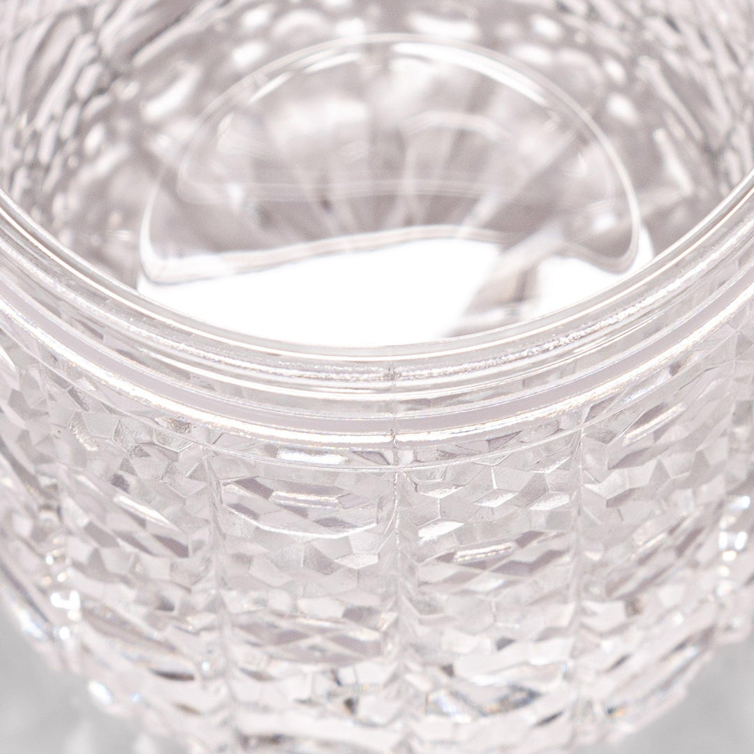 Rocks glass with lattice cut design, perfect for serving whiskey or spirits with a sophisticated touch.