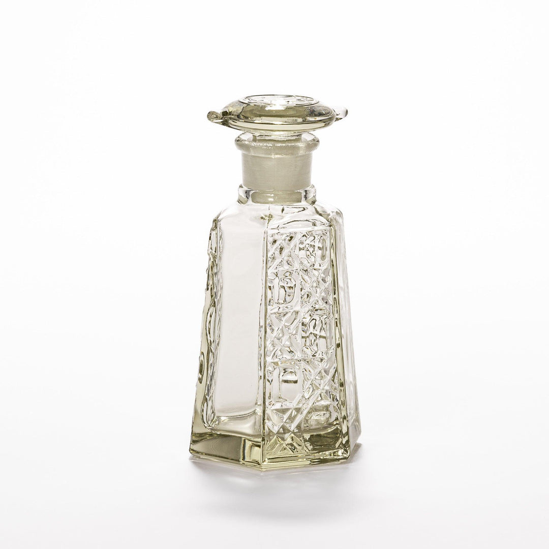 Stylish soy sauce dispenser with a geometric lattice cut design, featuring a smooth pour spout and elegant hexagonal base.