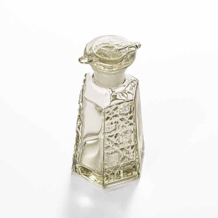 Stylish soy sauce dispenser with a geometric lattice cut design, featuring a smooth pour spout and elegant hexagonal base.