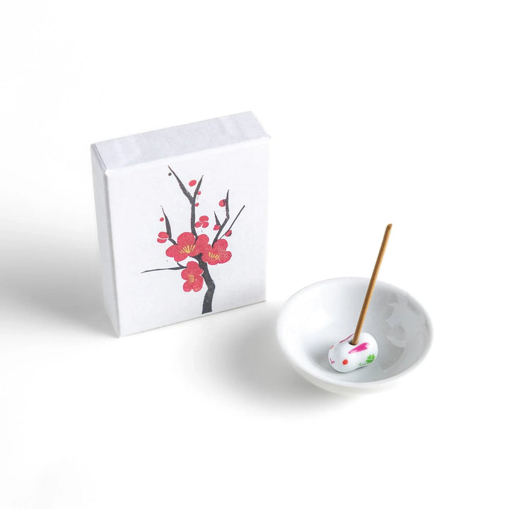 Japanese plum blossom incense with warm brown sticks in illustrated box offering sweet subtle floral fragrance.