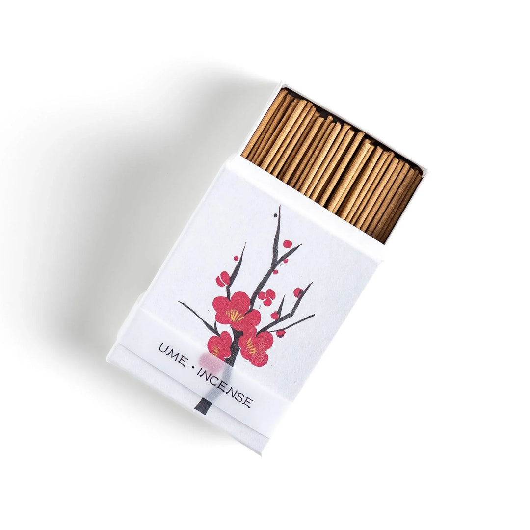 Japanese plum blossom incense with warm brown sticks in illustrated box offering sweet subtle floral fragrance.